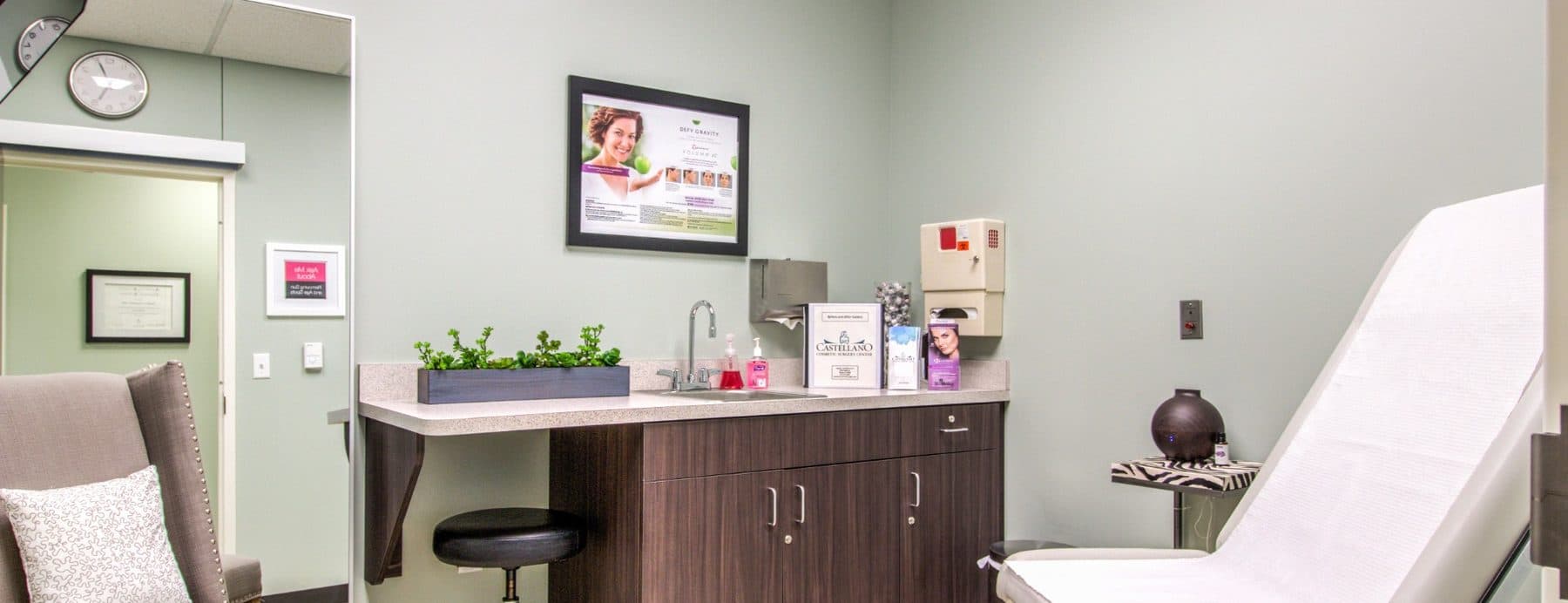 A consultation room at the practice, with an exam chair and a seat for the patient